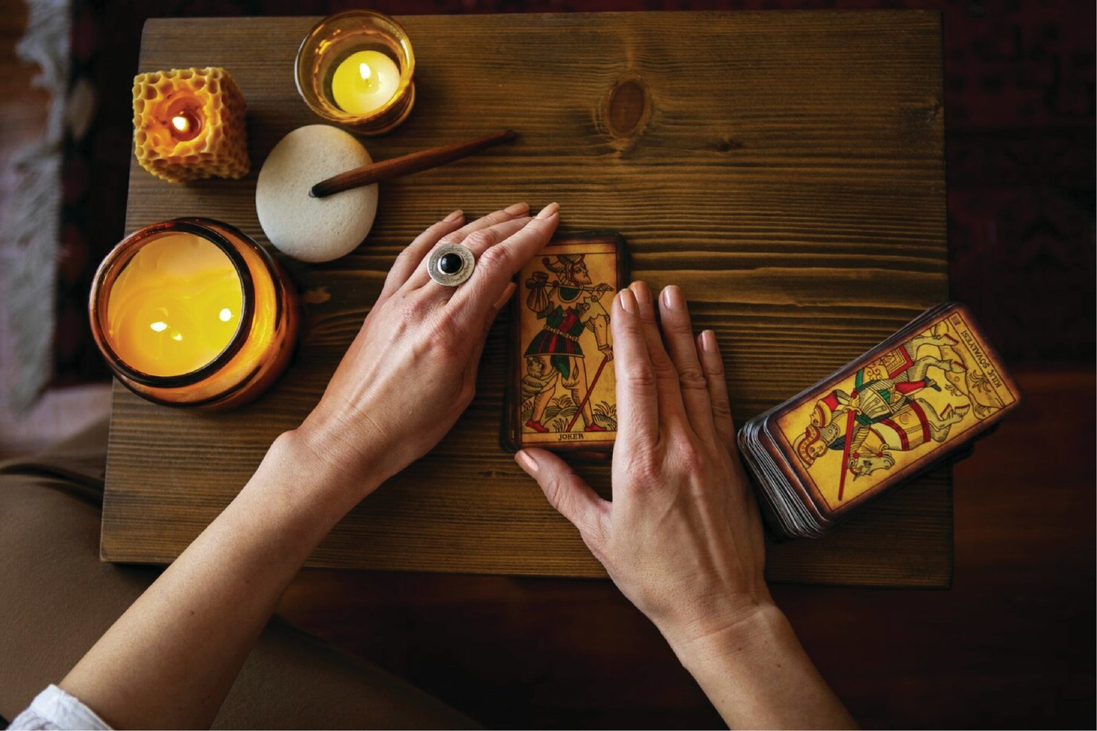 A person sitting at a table with a cell phone